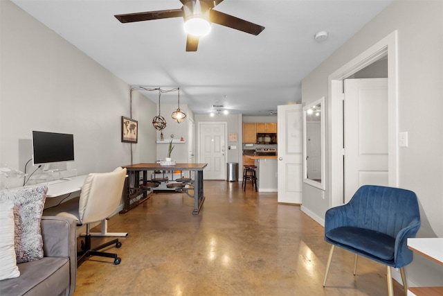 office space with concrete floors and ceiling fan