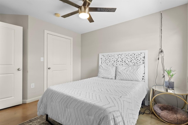 bedroom with ceiling fan and light hardwood / wood-style flooring