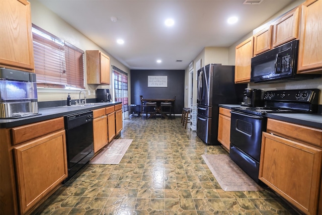 kitchen with sink and black appliances