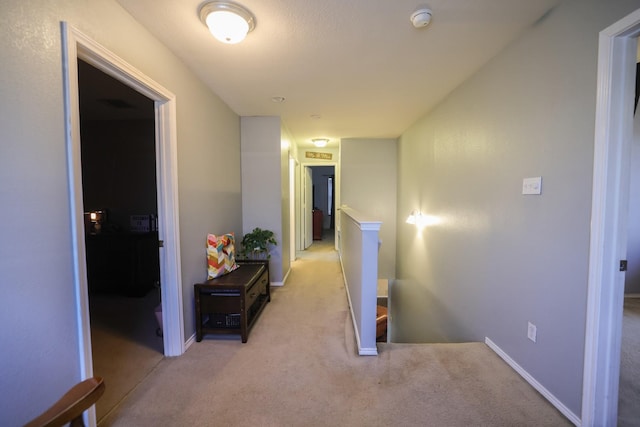 hallway with light carpet