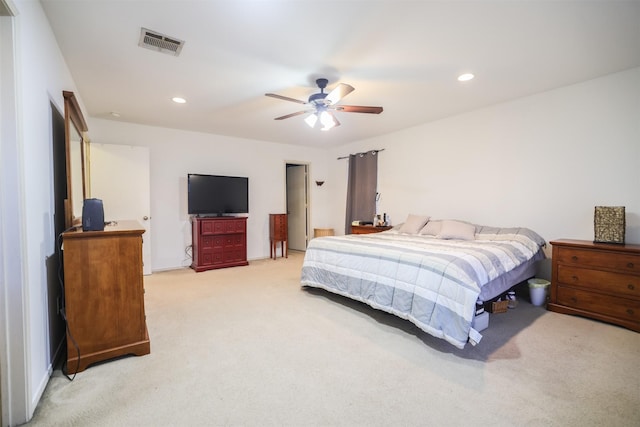 bedroom featuring light colored carpet and ceiling fan