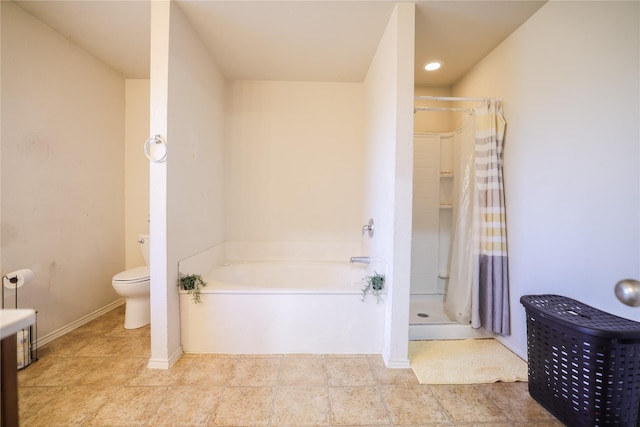 bathroom with toilet and separate shower and tub