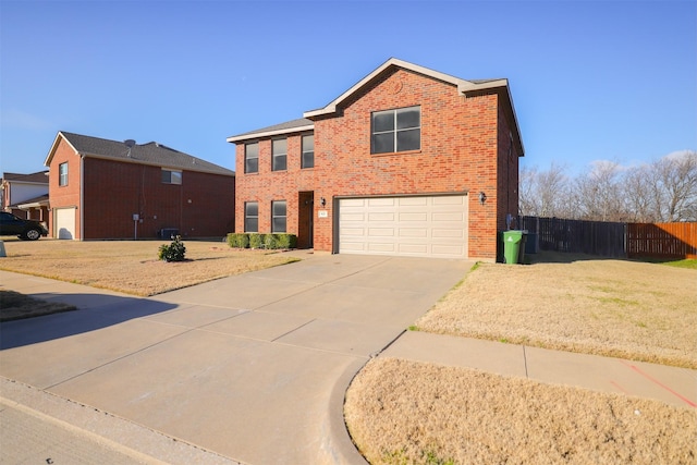 view of front of home featuring a garage and a front yard