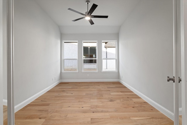 spare room featuring vaulted ceiling, ceiling fan, and light hardwood / wood-style floors