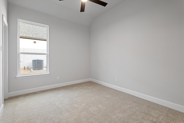 carpeted spare room with ceiling fan and lofted ceiling