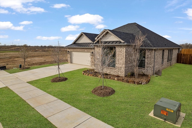 view of front facade featuring a garage and a front lawn