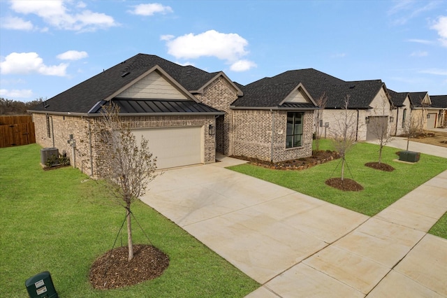 view of front of property with a garage, a front yard, and central air condition unit