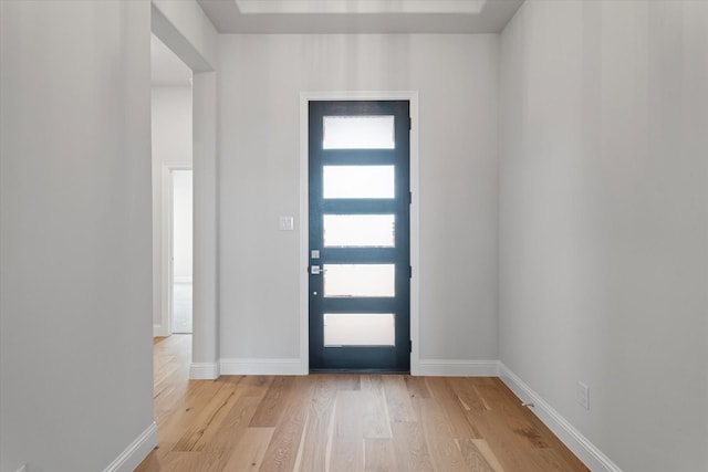 entrance foyer featuring plenty of natural light and light hardwood / wood-style flooring