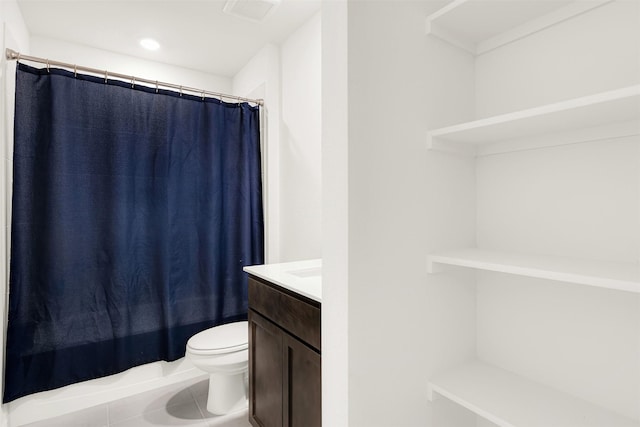 full bathroom with vanity, toilet, shower / bath combo with shower curtain, and tile patterned flooring