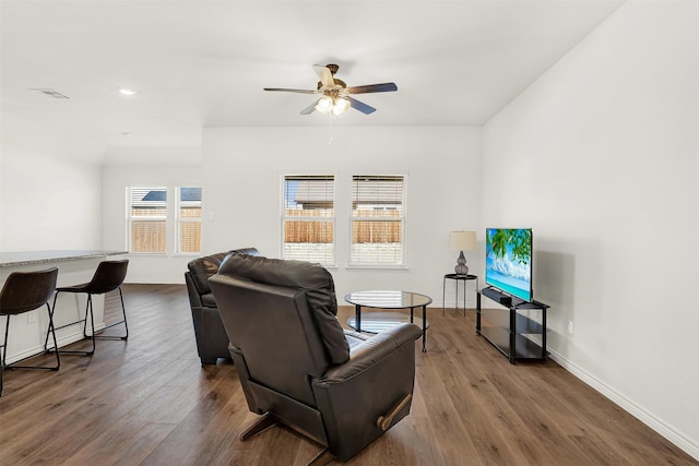 living room with ceiling fan and wood-type flooring