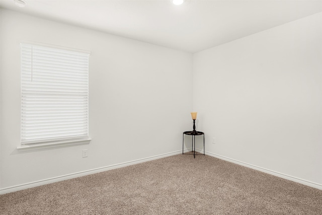 unfurnished room featuring carpet flooring