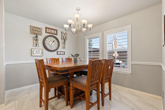 dining area with a notable chandelier