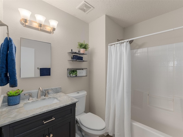 full bathroom featuring vanity, toilet, shower / bath combo, and a textured ceiling