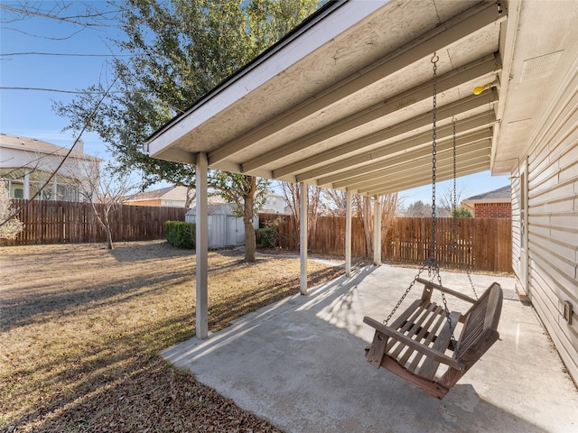 view of patio with a storage shed