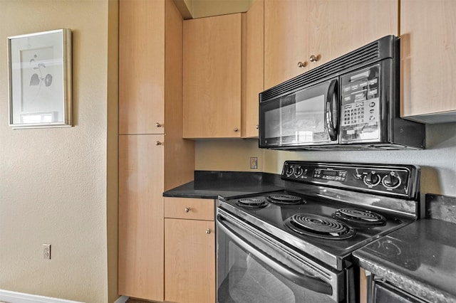 kitchen featuring black appliances and light brown cabinetry