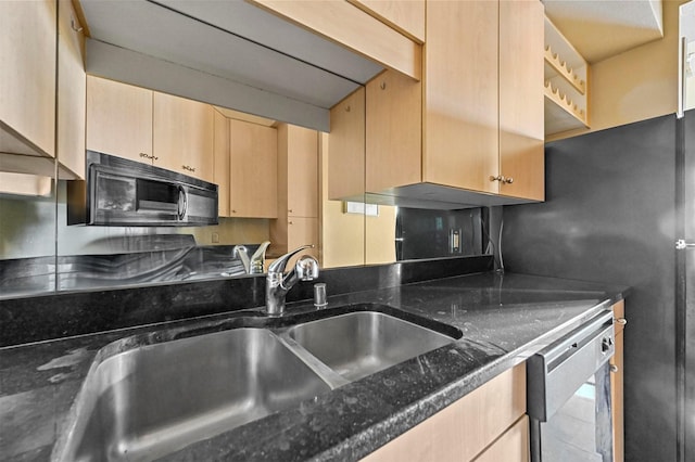 kitchen with sink, dishwasher, dark stone counters, and light brown cabinets