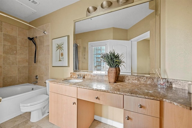 full bathroom with toilet, vanity, and tiled shower / bath combo