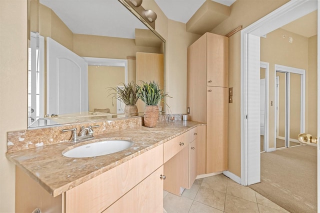 bathroom with vanity and tile patterned flooring