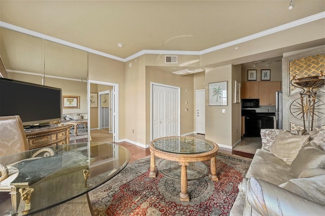 living room featuring crown molding and light hardwood / wood-style floors