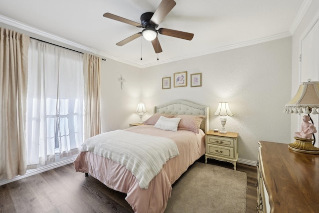 bedroom featuring dark hardwood / wood-style floors, ceiling fan, and ornamental molding