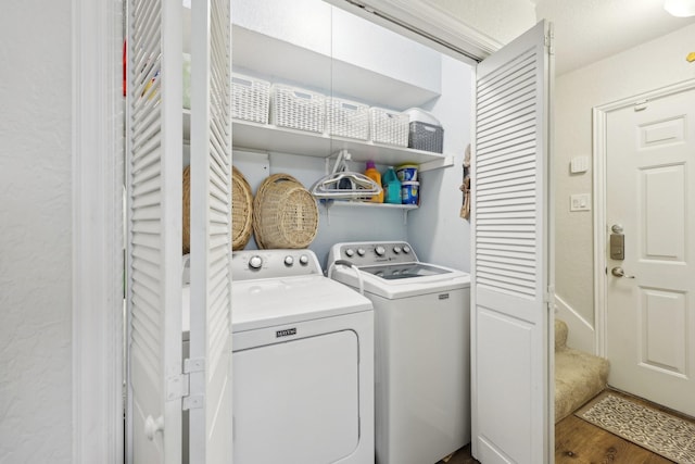 laundry area featuring dark hardwood / wood-style flooring and washing machine and clothes dryer