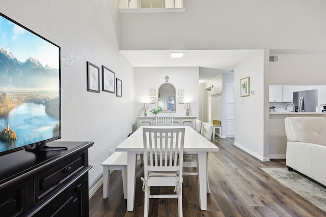 dining room with wood-type flooring