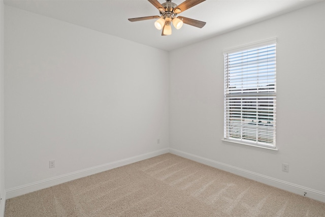 spare room with ceiling fan and carpet floors