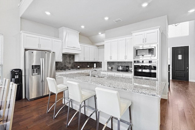 kitchen featuring sink, white cabinets, and stainless steel appliances