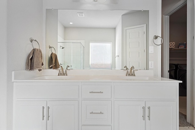 bathroom with an enclosed shower and vanity