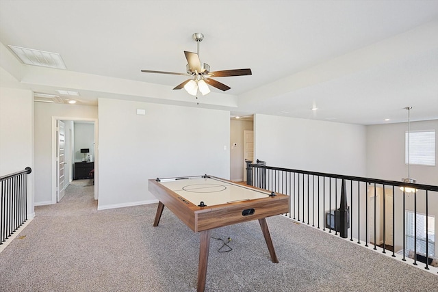 playroom with ceiling fan and light colored carpet