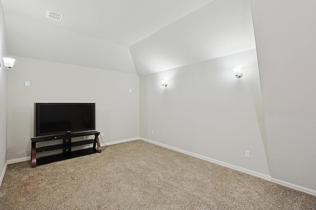 carpeted living room with lofted ceiling