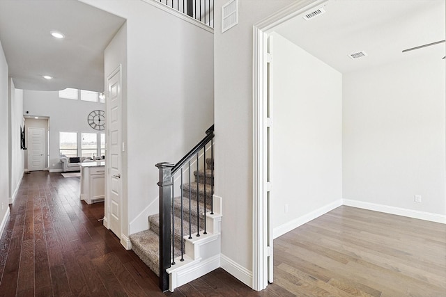 stairs featuring hardwood / wood-style flooring