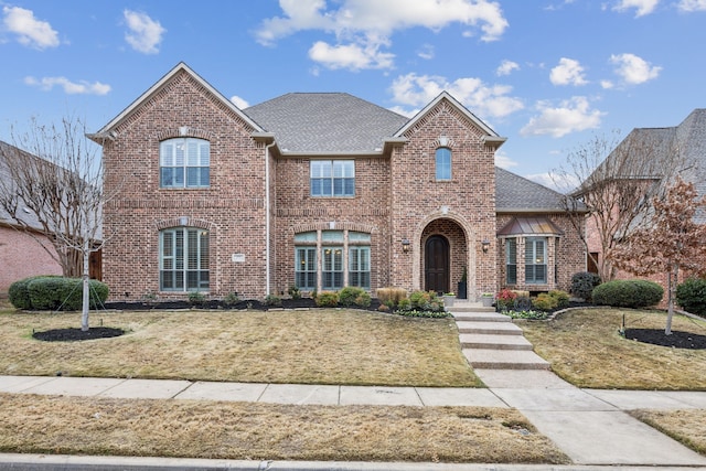 front facade featuring a front lawn