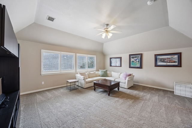 living room with ceiling fan, carpet floors, and lofted ceiling