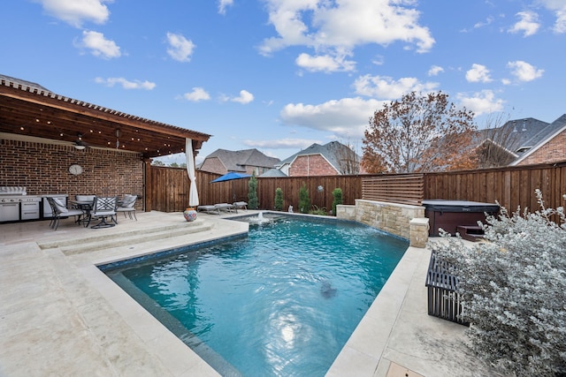 view of swimming pool with a hot tub, pool water feature, a grill, ceiling fan, and a patio area