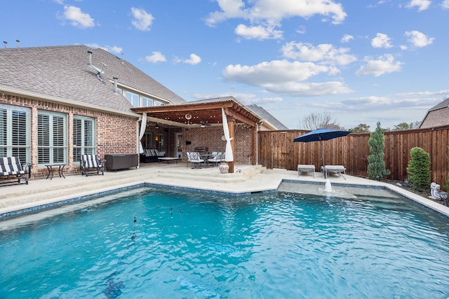 view of pool with a patio area and ceiling fan