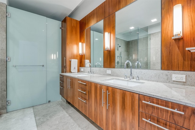 bathroom with walk in shower and vanity