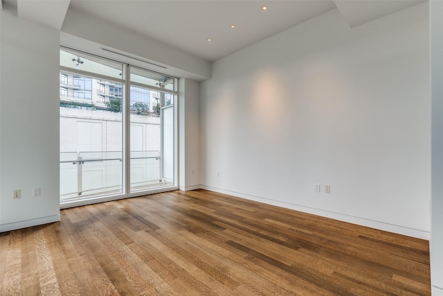 empty room featuring hardwood / wood-style flooring