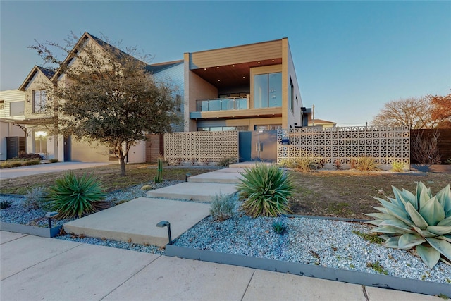 view of front of property with a balcony