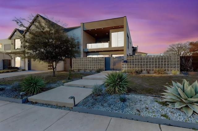 view of front of home with a balcony