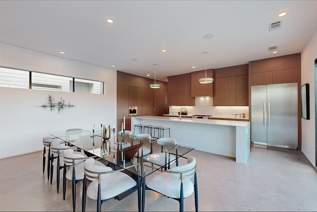 dining area featuring sink