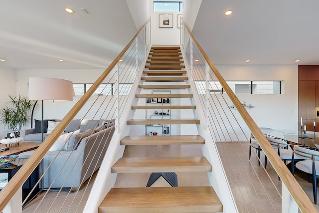 stairs with wood-type flooring