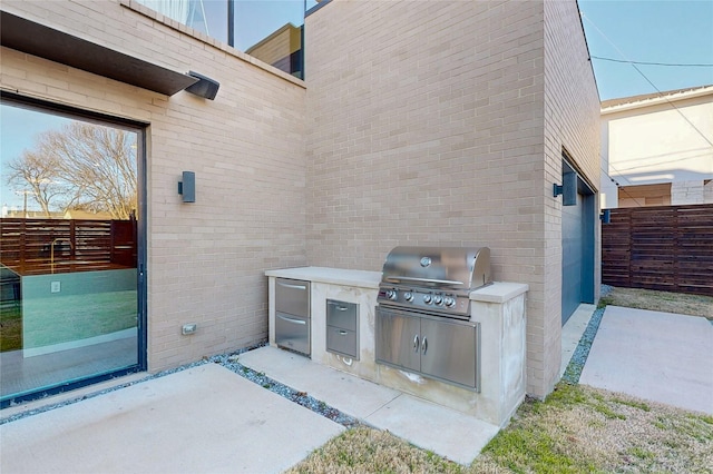 view of patio / terrace with a grill and area for grilling