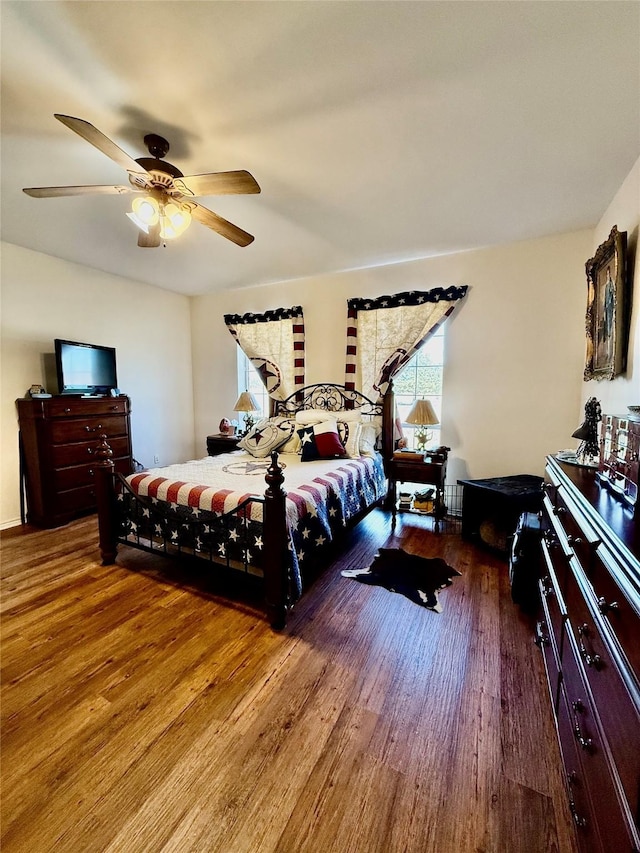 bedroom featuring ceiling fan and hardwood / wood-style floors