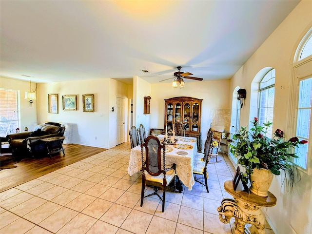 tiled dining room with ceiling fan