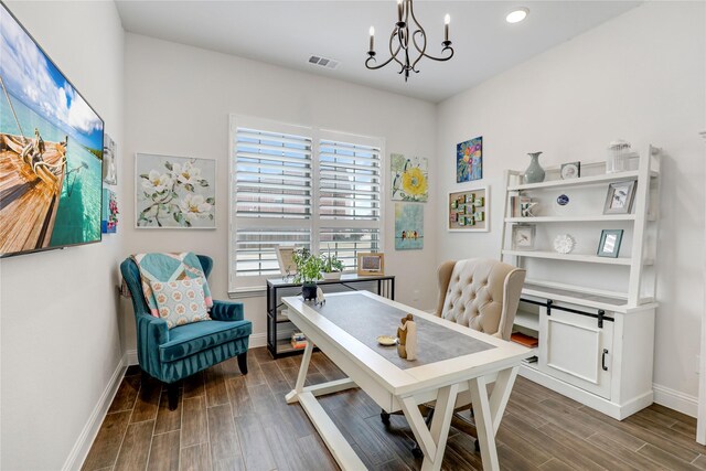 office space with an inviting chandelier