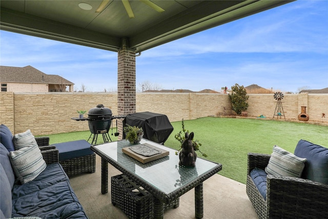 view of patio with area for grilling, an outdoor living space, and ceiling fan