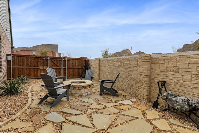 view of patio / terrace featuring an outdoor fire pit