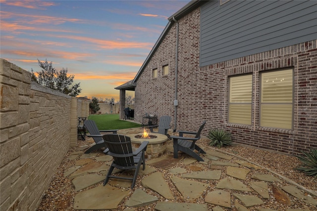 exterior space with a fire pit and a patio area