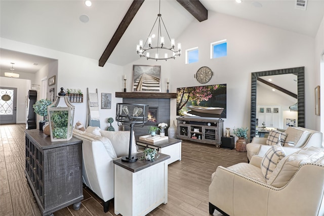 living room featuring beam ceiling, wood-type flooring, a chandelier, and high vaulted ceiling